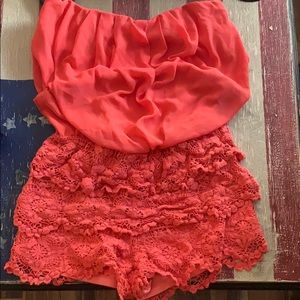 Coral romper with lace